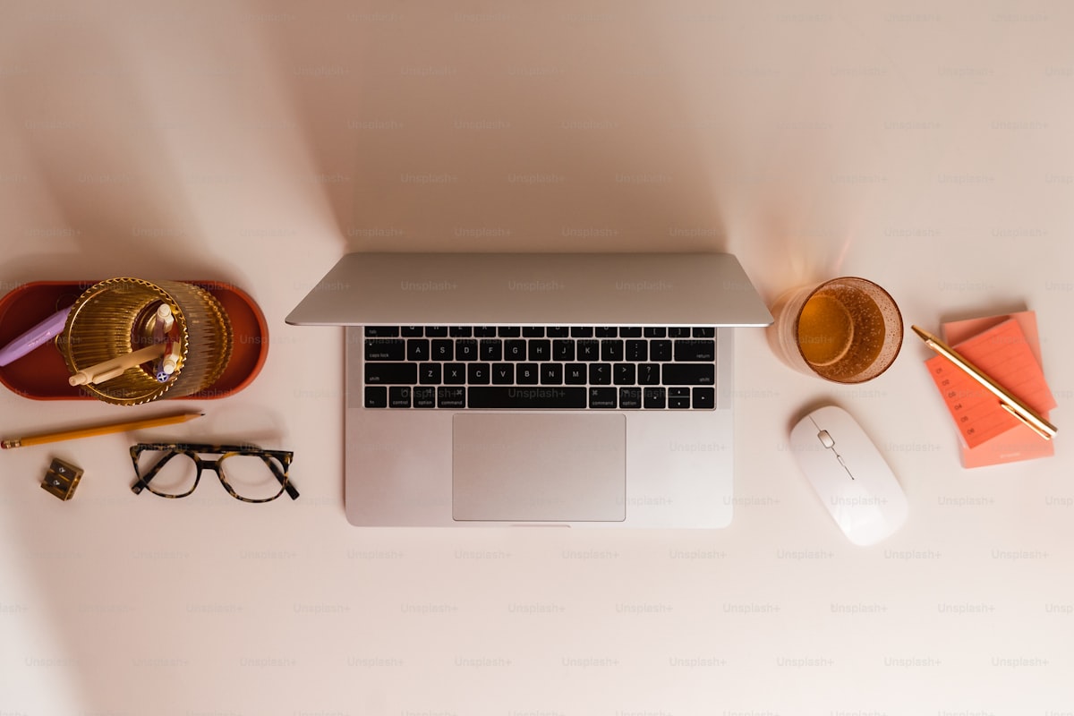 Solo business owner managing contacts on laptop in modern workspace