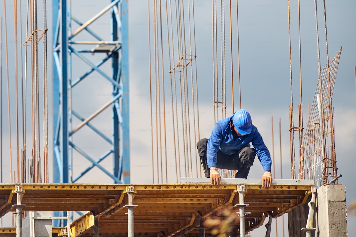 Construction builder managing projects with CRM on building site